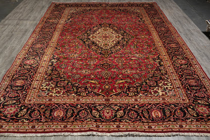 Kashan-style rug, curvilinear floral detail on red field