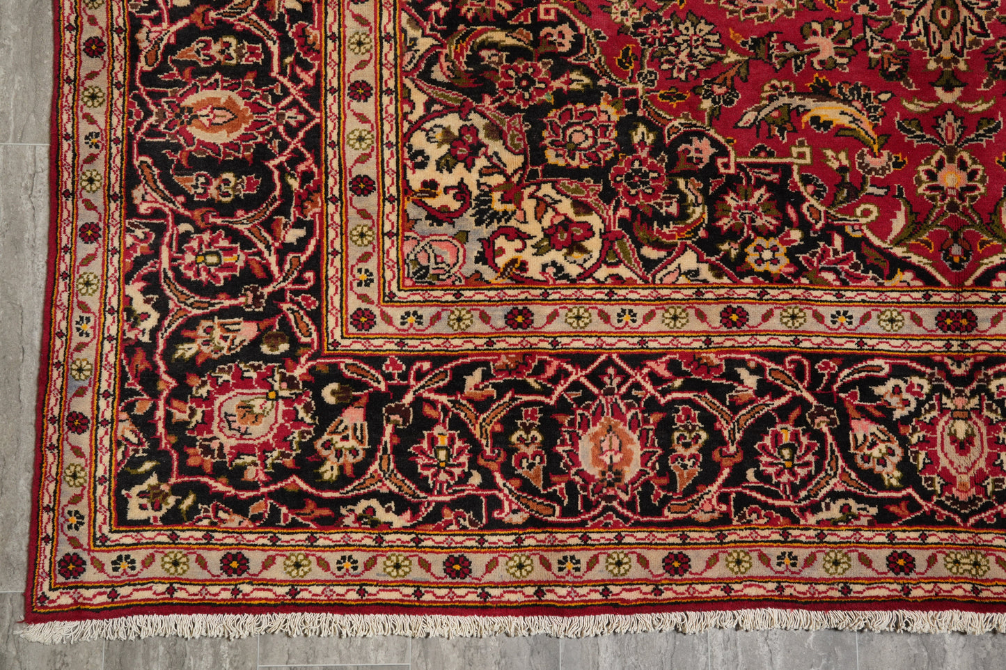 Kashan-style rug, color balance close-up between red field and ivory medallion