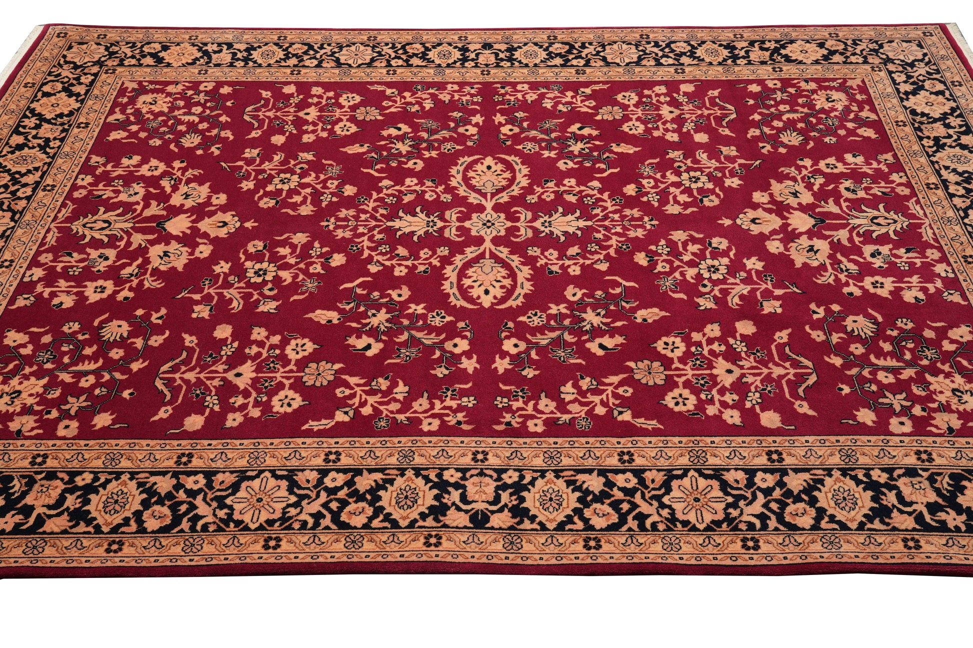 Sarouk-pattern wool rug, curvilinear floral detail on black field