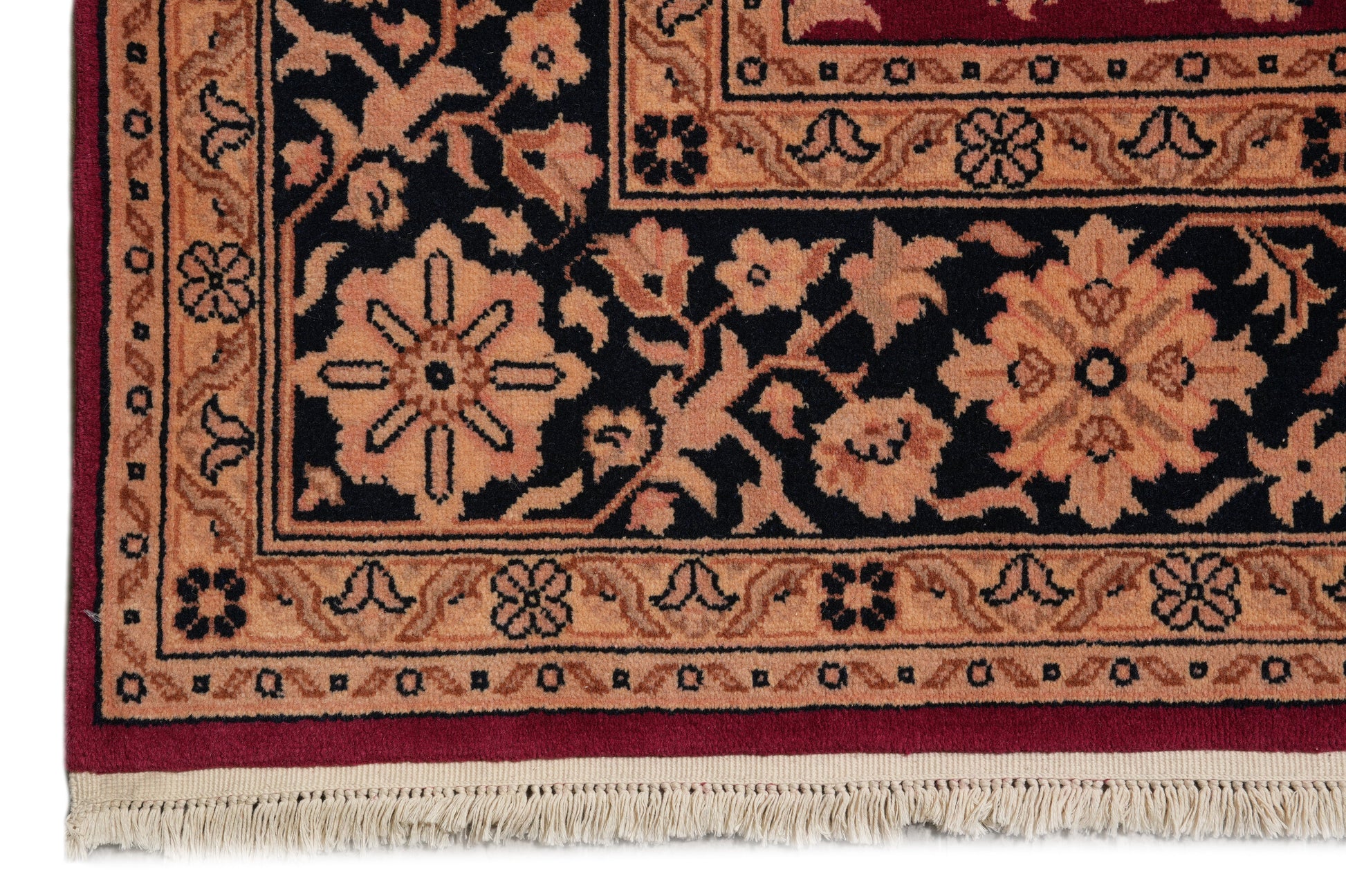 Sarouk-pattern wool rug, edge and selvedge detail