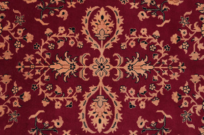 Sarouk-pattern wool rug, partial overhead view in natural light