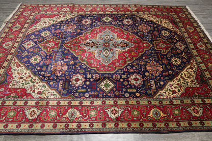 Pre-owned Tabriz-style blue rug, central medallion close-up in navy and ivory