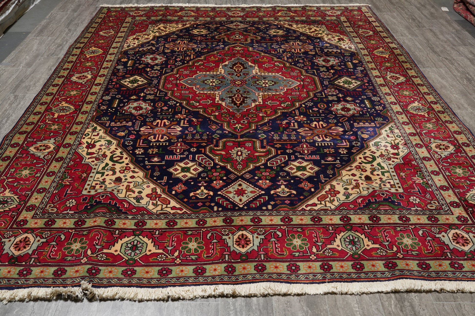 Pre-owned Tabriz-style blue rug, fine curvilinear pattern detail