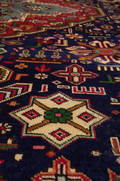 Pre-owned Tabriz-style blue rug, secondary medallion close-up