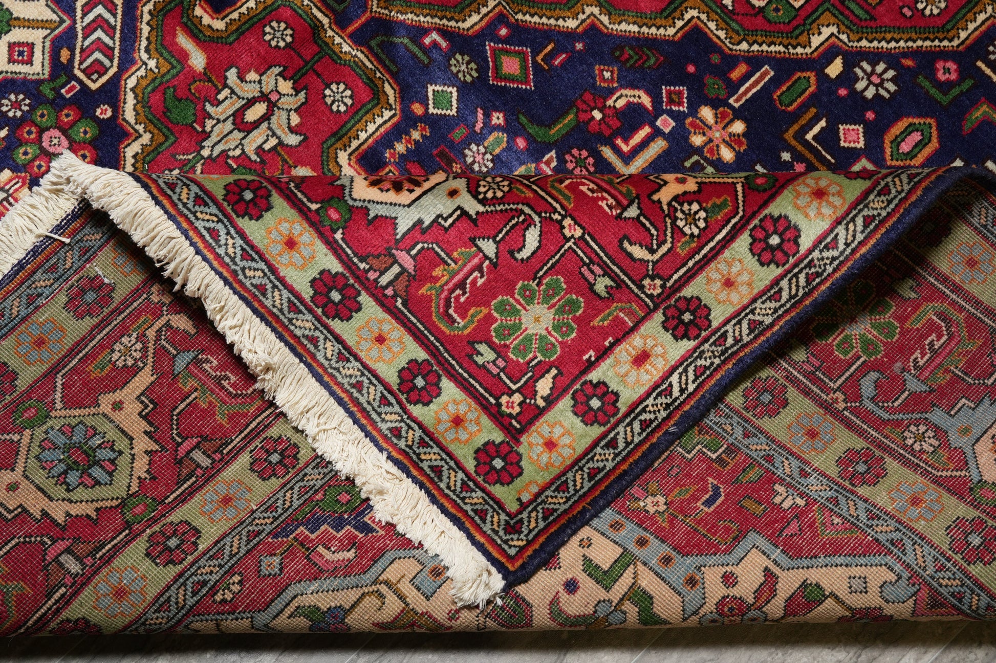 Pre-owned Tabriz-style blue rug, edge and selvedge detail