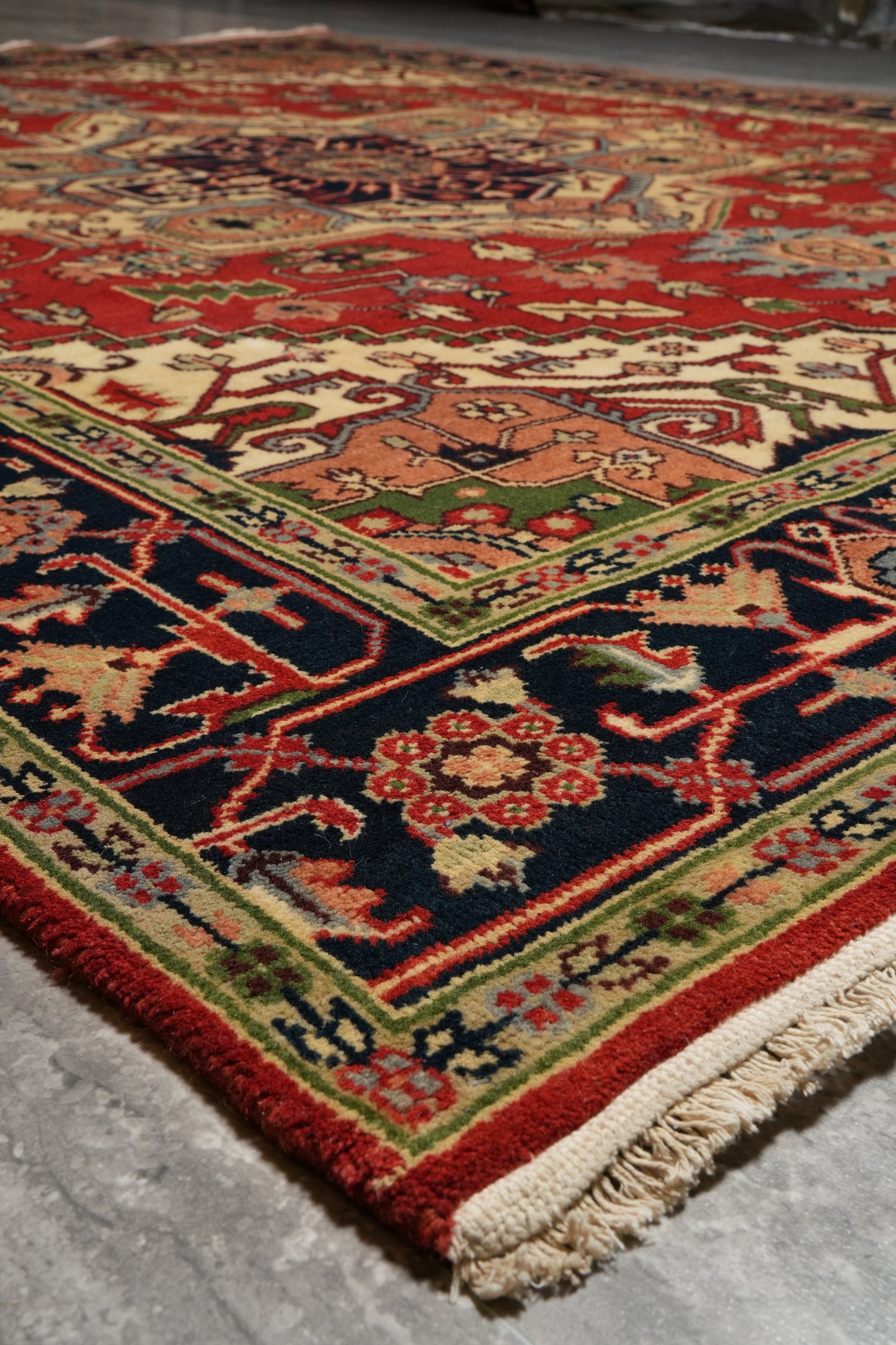 Heriz-Serapi-style rug, color balance detail between red field and ivory border