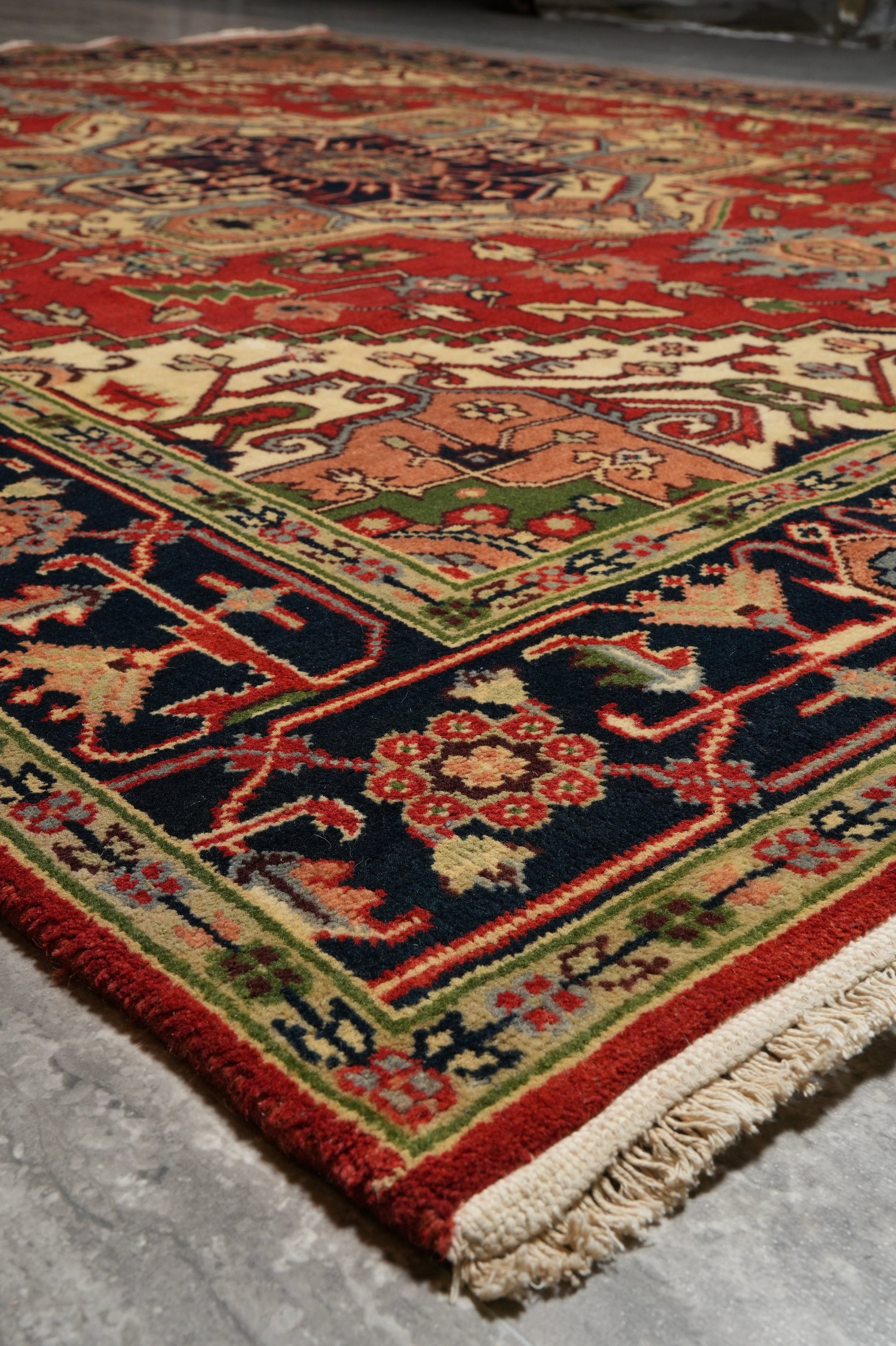 Heriz-Serapi-style rug, color balance detail between red field and ivory border