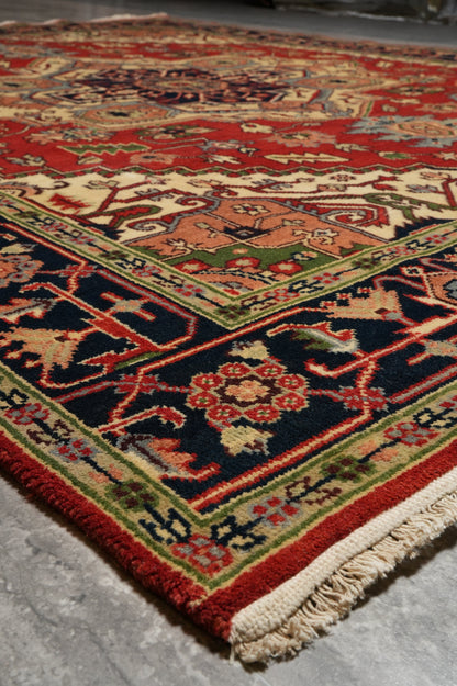 Heriz-Serapi-style rug, color balance detail between red field and ivory border