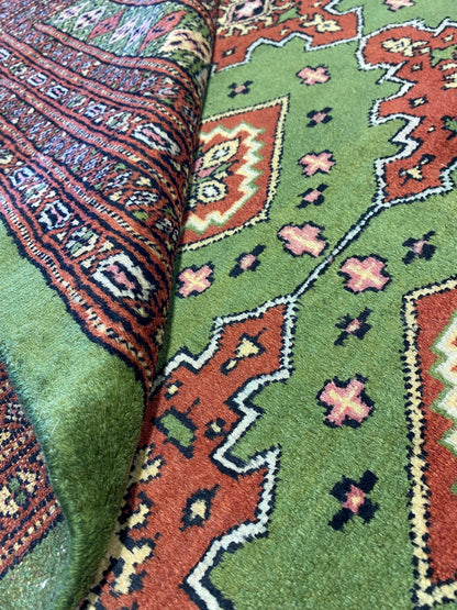 Sage green Jaldar Bokhara, secondary gul cluster close-up