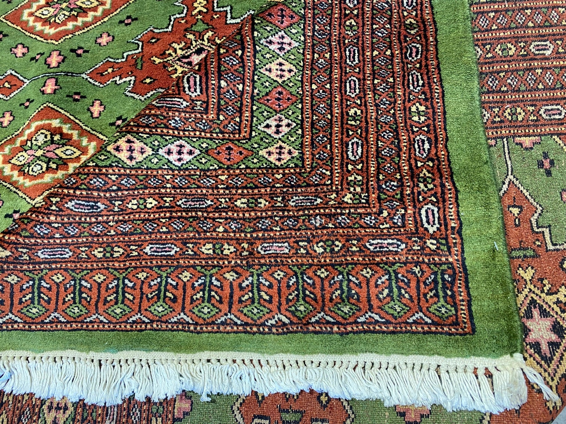 Sage green Jaldar Bokhara, corner motif with traditional gul