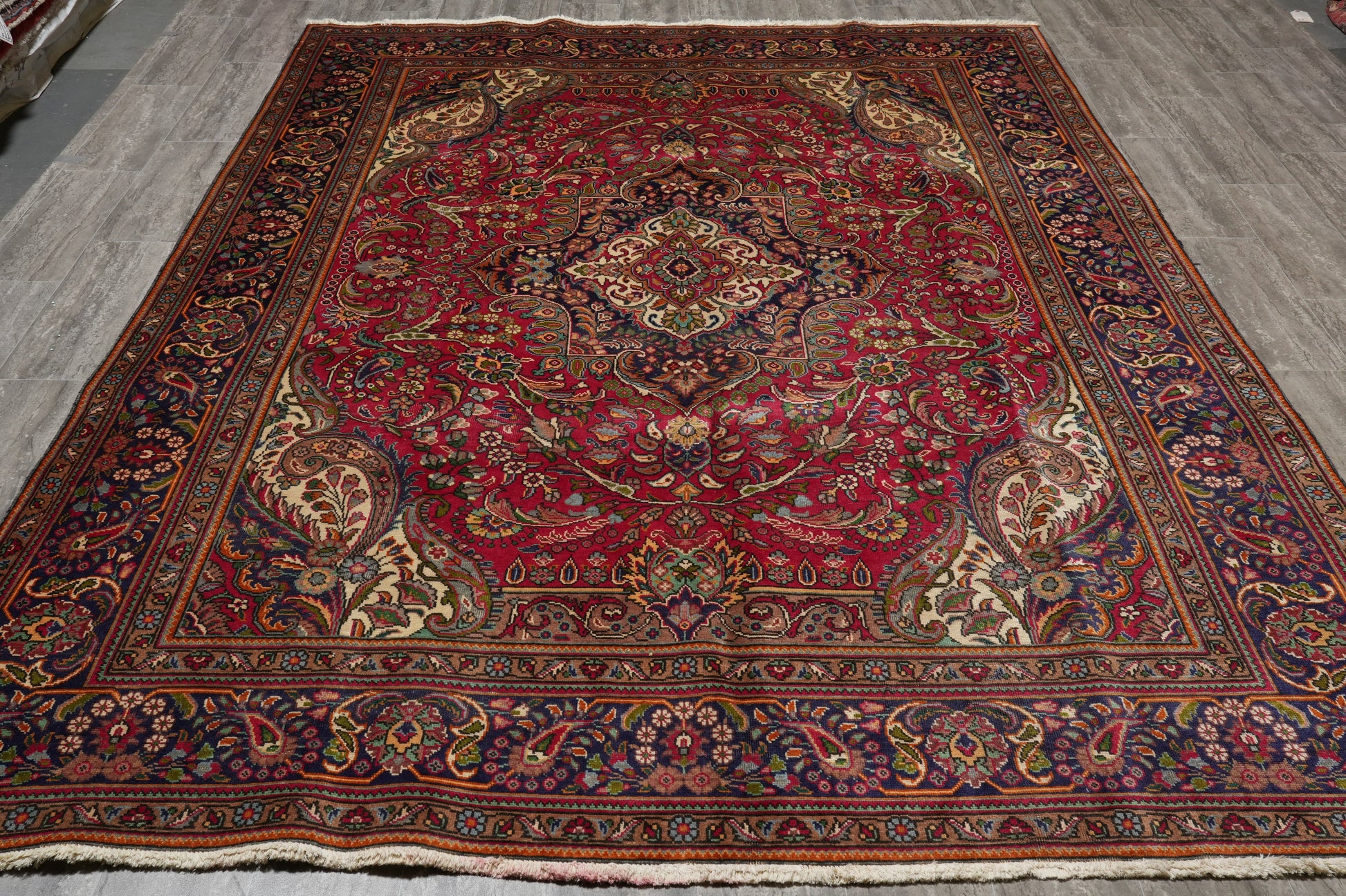 Pre-owned Tabriz-style blue rug, fine curvilinear pattern close-up