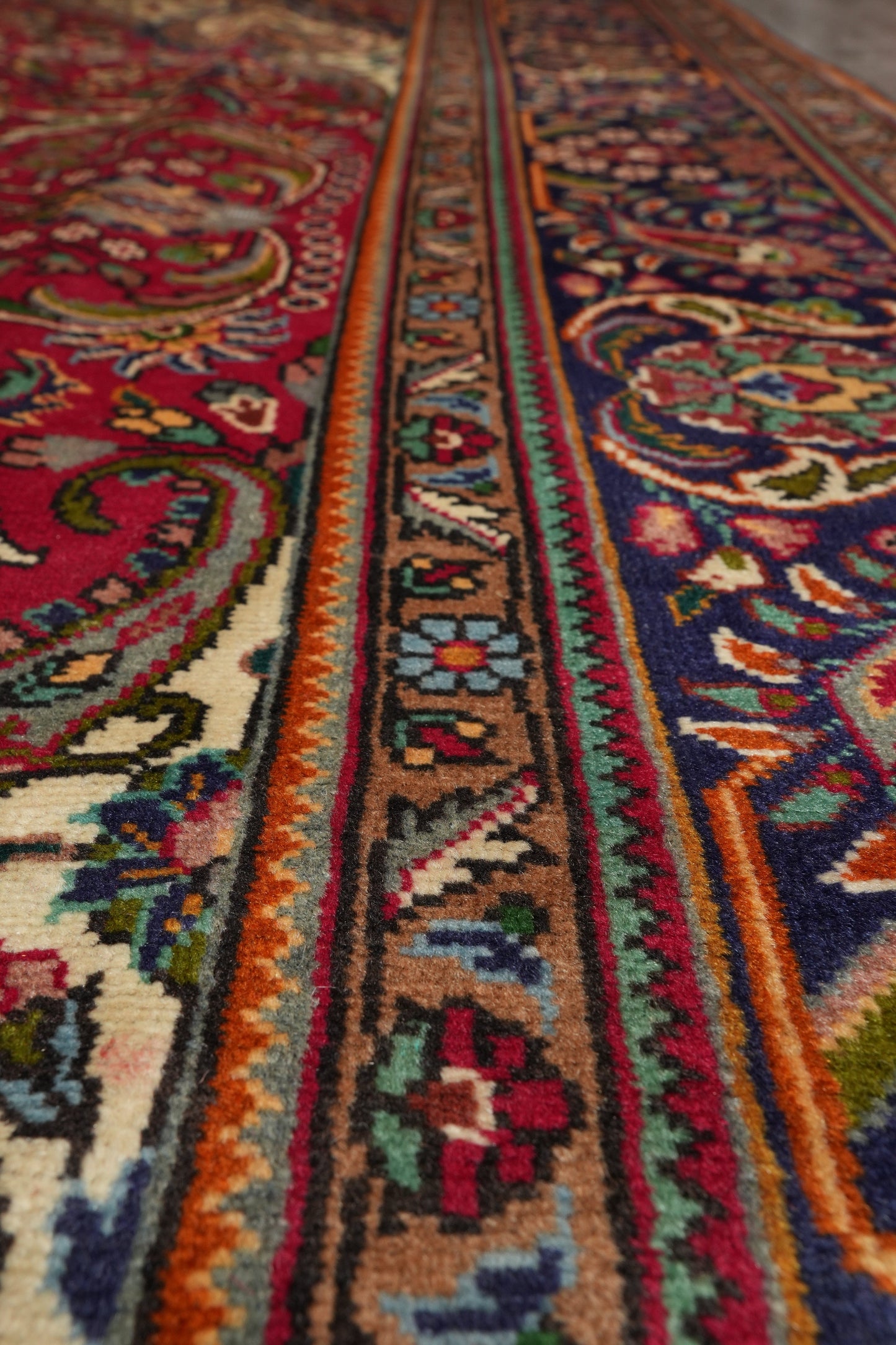 Pre-owned Tabriz-style blue rug, alternate corner showing pattern continuity