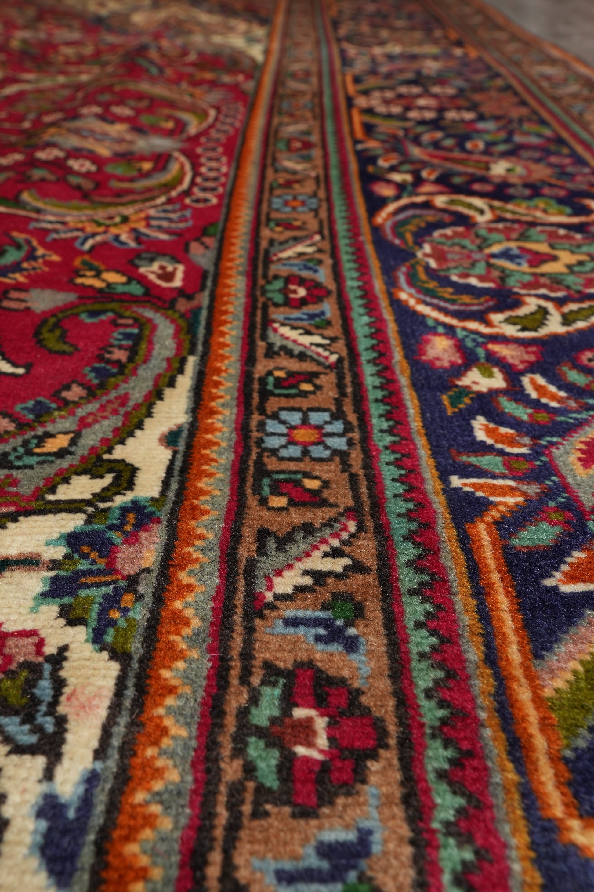 Pre-owned Tabriz-style blue rug, alternate corner showing pattern continuity
