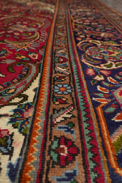 Pre-owned Tabriz-style blue rug, alternate corner showing pattern continuity