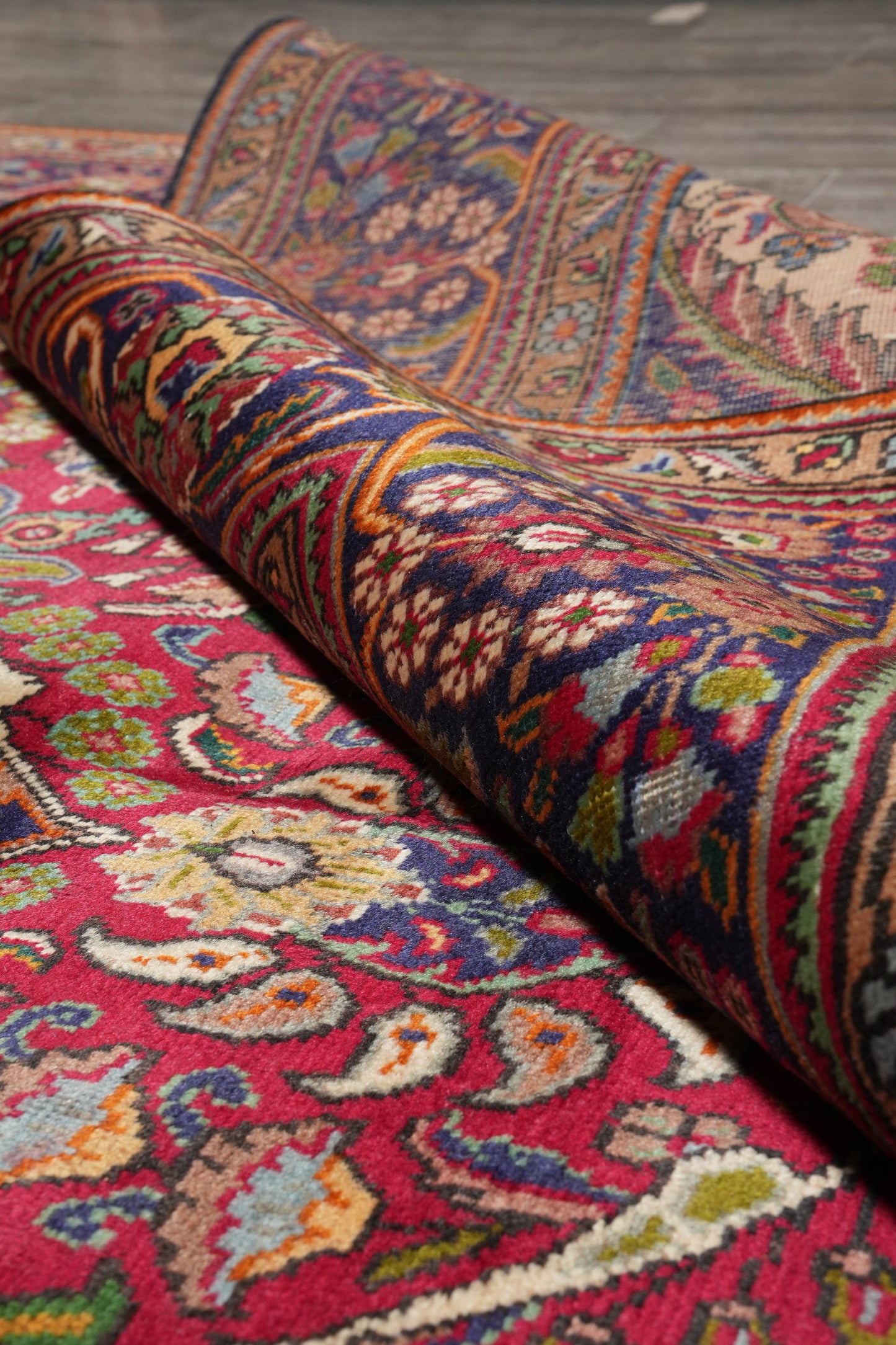 Pre-owned Tabriz-style blue rug, pile texture close-up showing wool depth