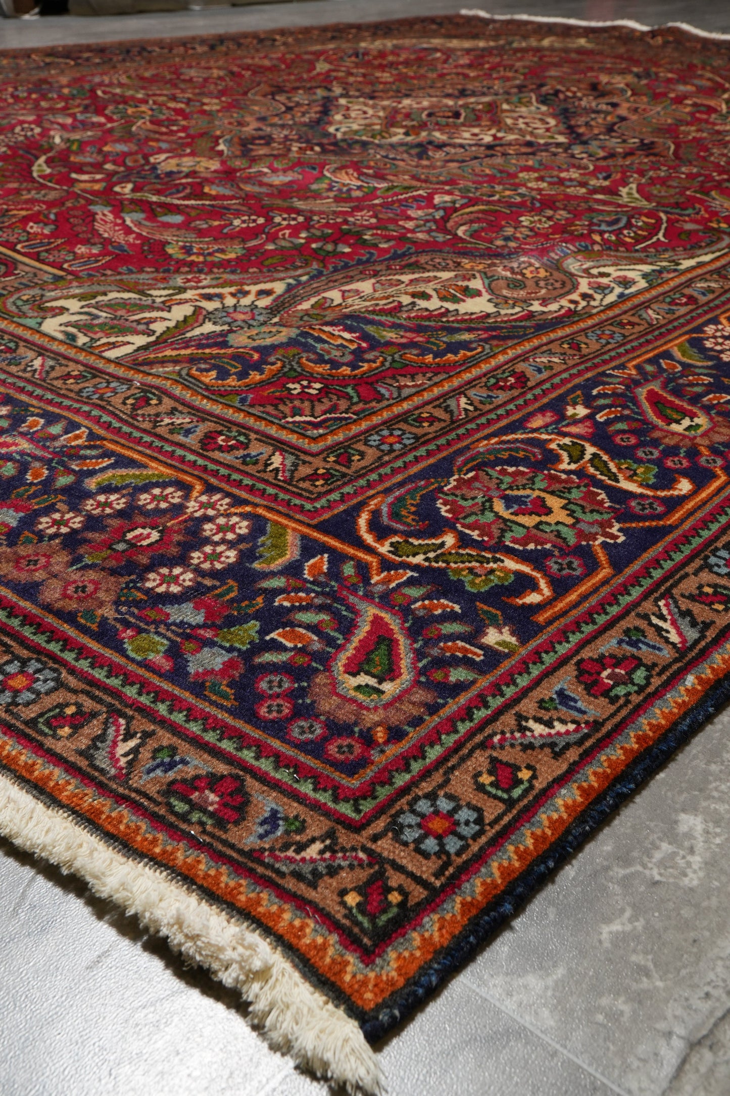 Pre-owned Tabriz-style blue rug, mid-field floral vine detail