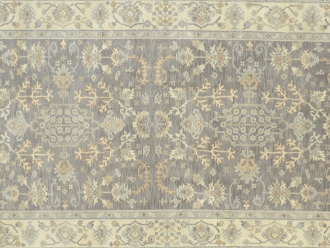 Neutral gray rug, ivory motif close-up against gray field