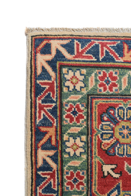 Afghan Kazak ivory rug, border pattern detail in red and ivory