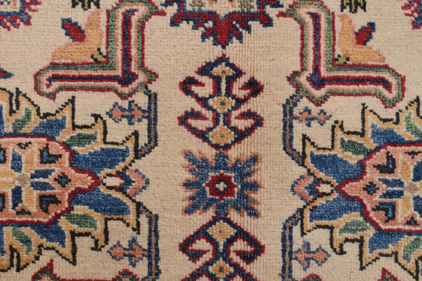 Afghan Kazak ivory rug, corner motif with tribal geometry