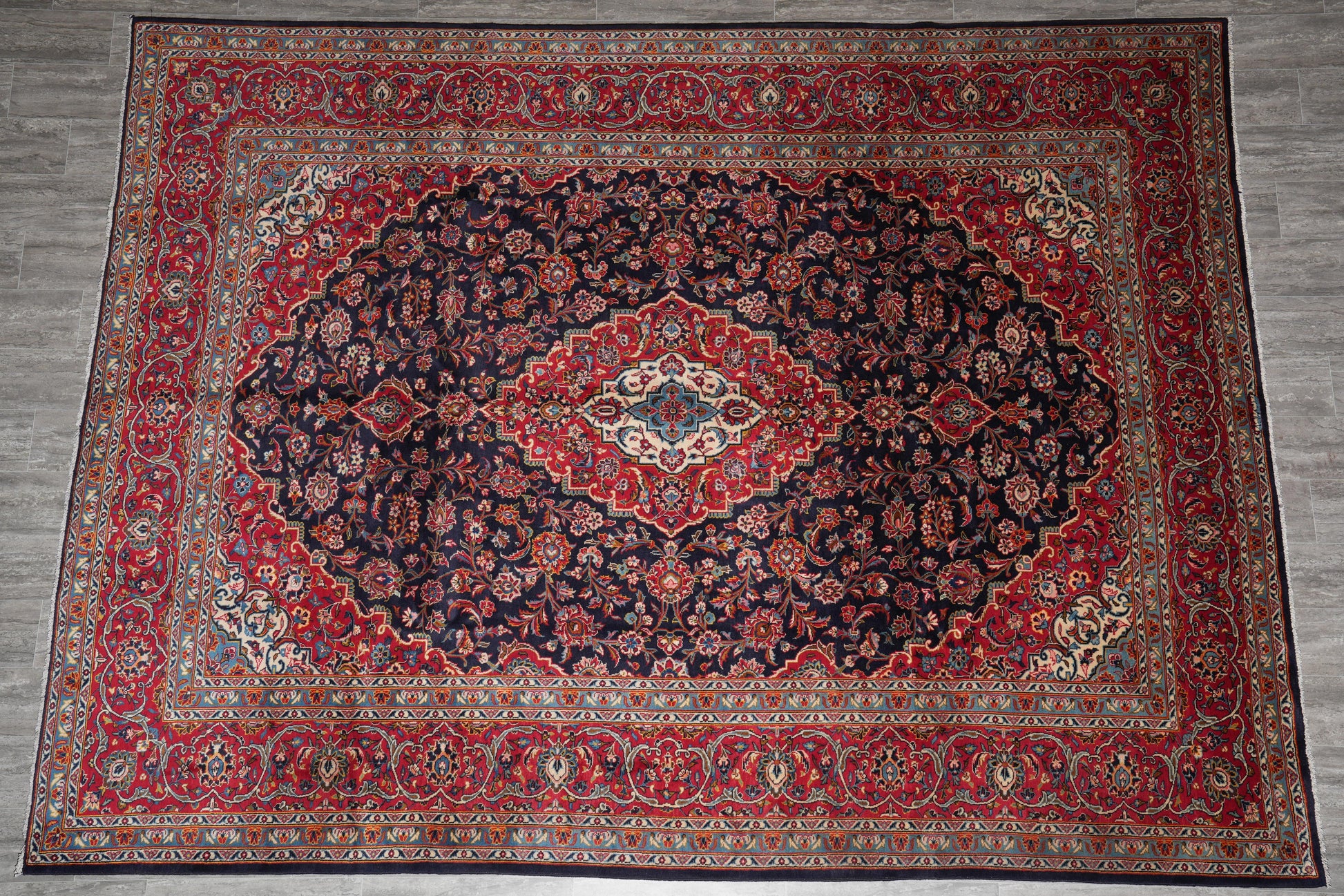 Signed Kashan-style navy rug, alternate top view showing the full medallion