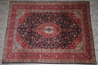 Signed Kashan-style navy rug, alternate top view showing the full medallion