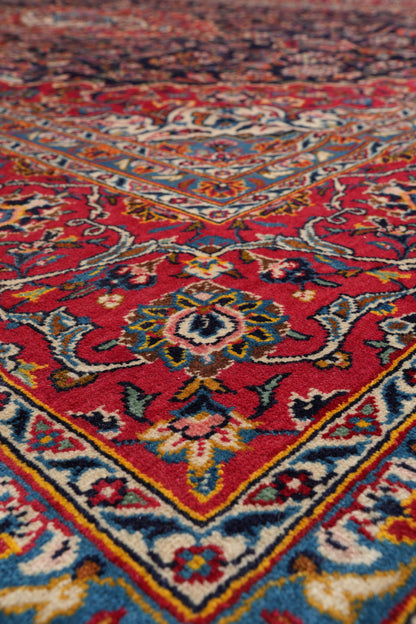 Signed Kashan-style navy rug, weaver signature panel close-up