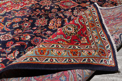 Signed Kashan-style navy rug, edge and selvedge detail