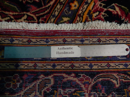 Semi-antique maroon Kashan-style rug, pile texture showing aged wool patina