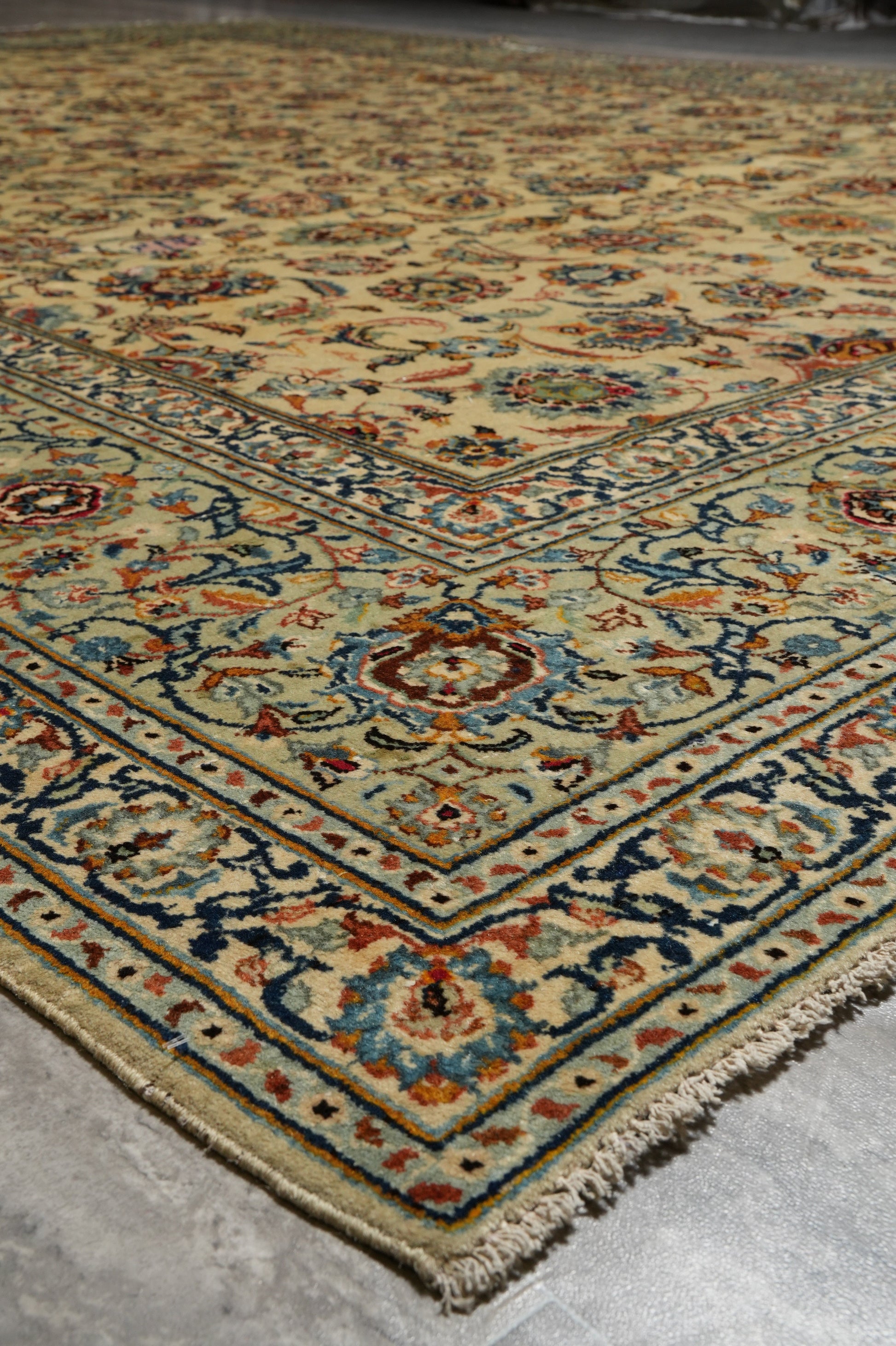 Vintage Kashan-style ivory rug, pile texture showing aged wool depth