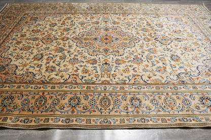 Kashan-style ivory floral rug, central medallion close-up in red and navy