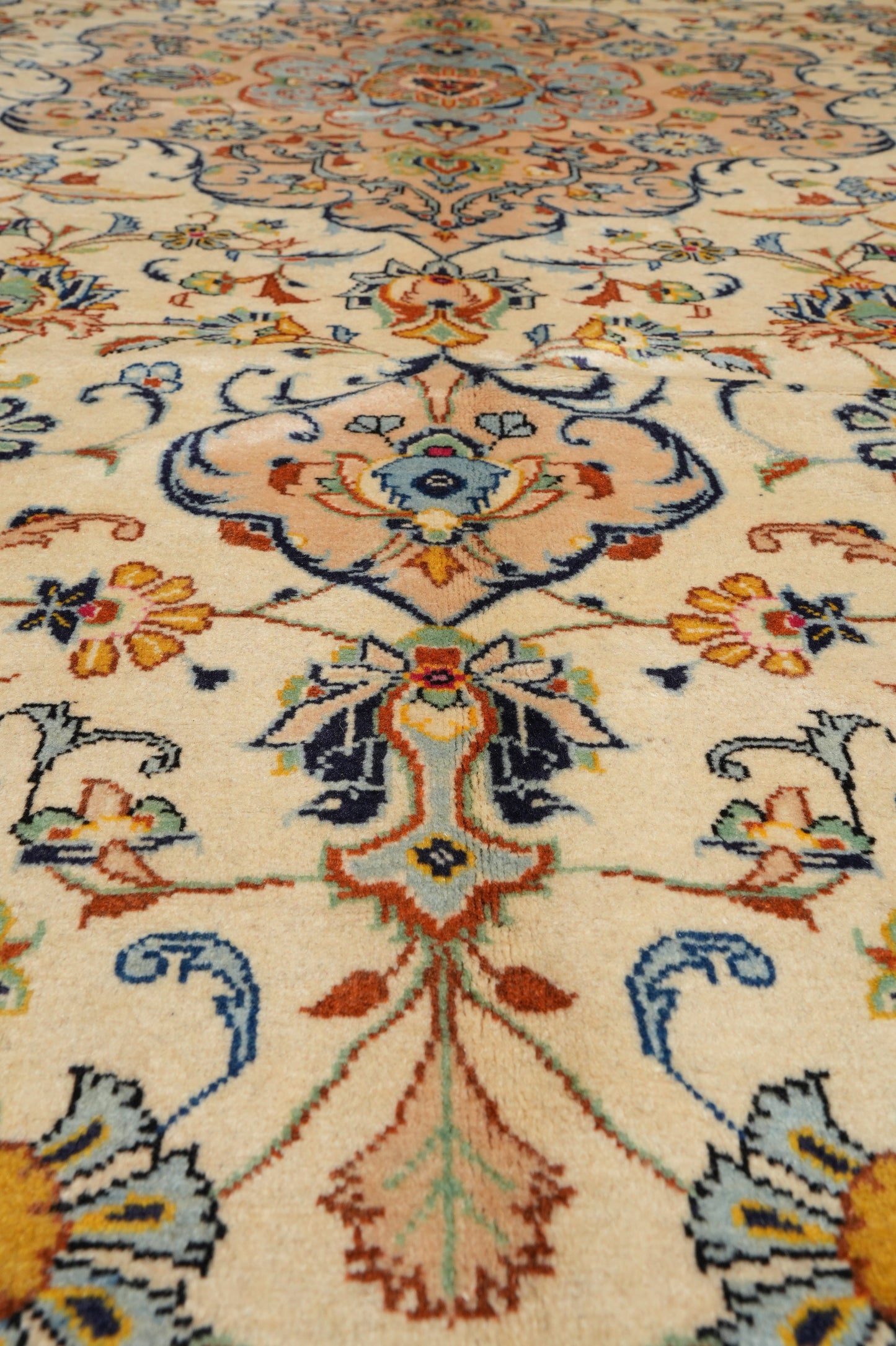 Kashan-style ivory floral rug, alternate corner showing floral continuity