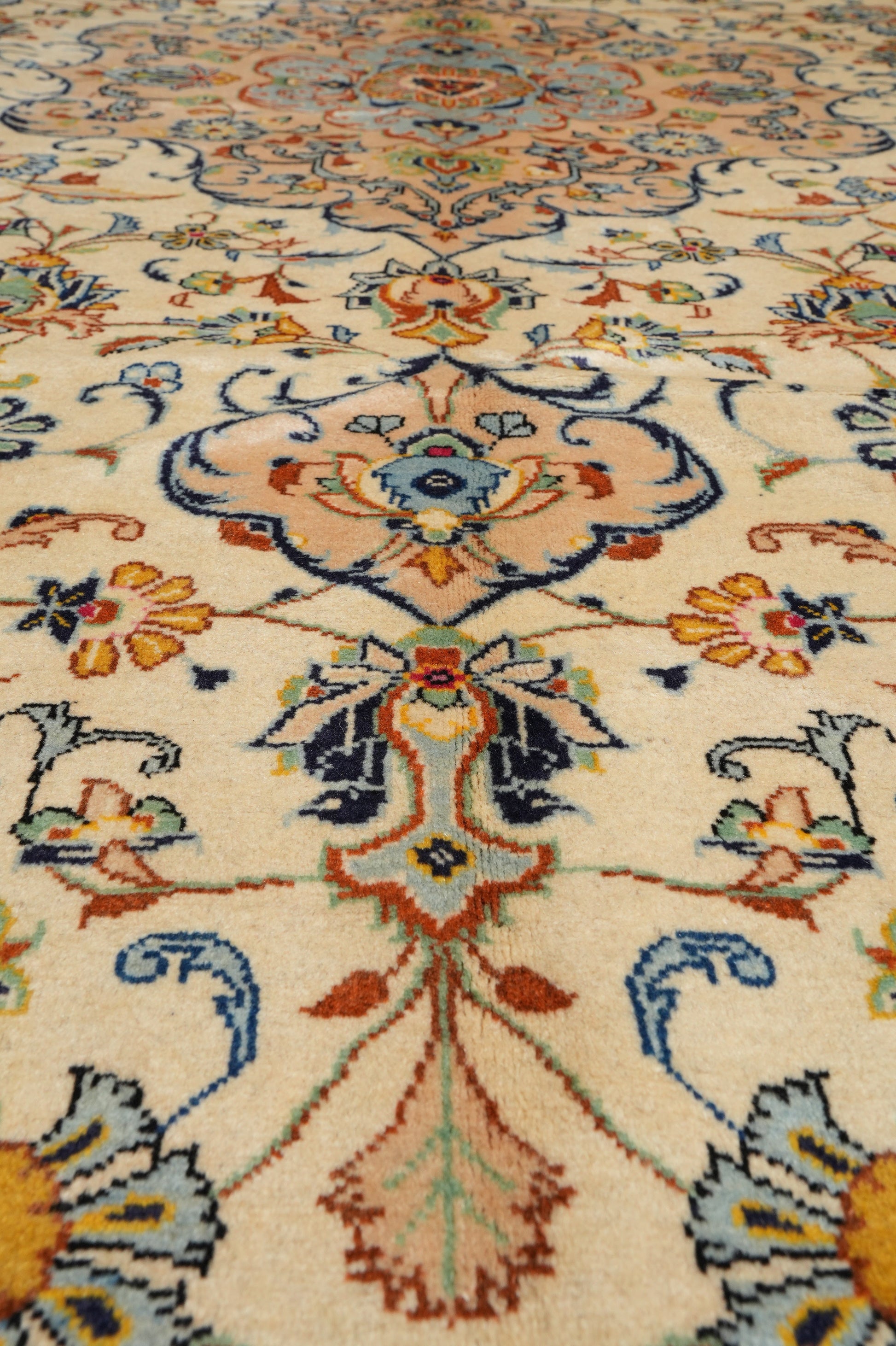 Kashan-style ivory floral rug, alternate corner showing floral continuity