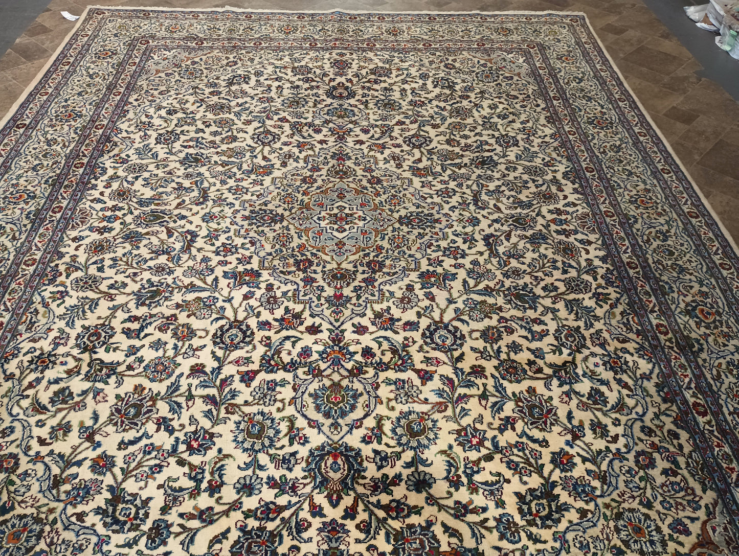 Semi-antique Kashan-style ivory rug, corner motif with intricate floral arabesques