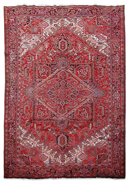 9 x 13 hand-knotted Heriz-style wool rug, top view of red and ivory geometric medallion